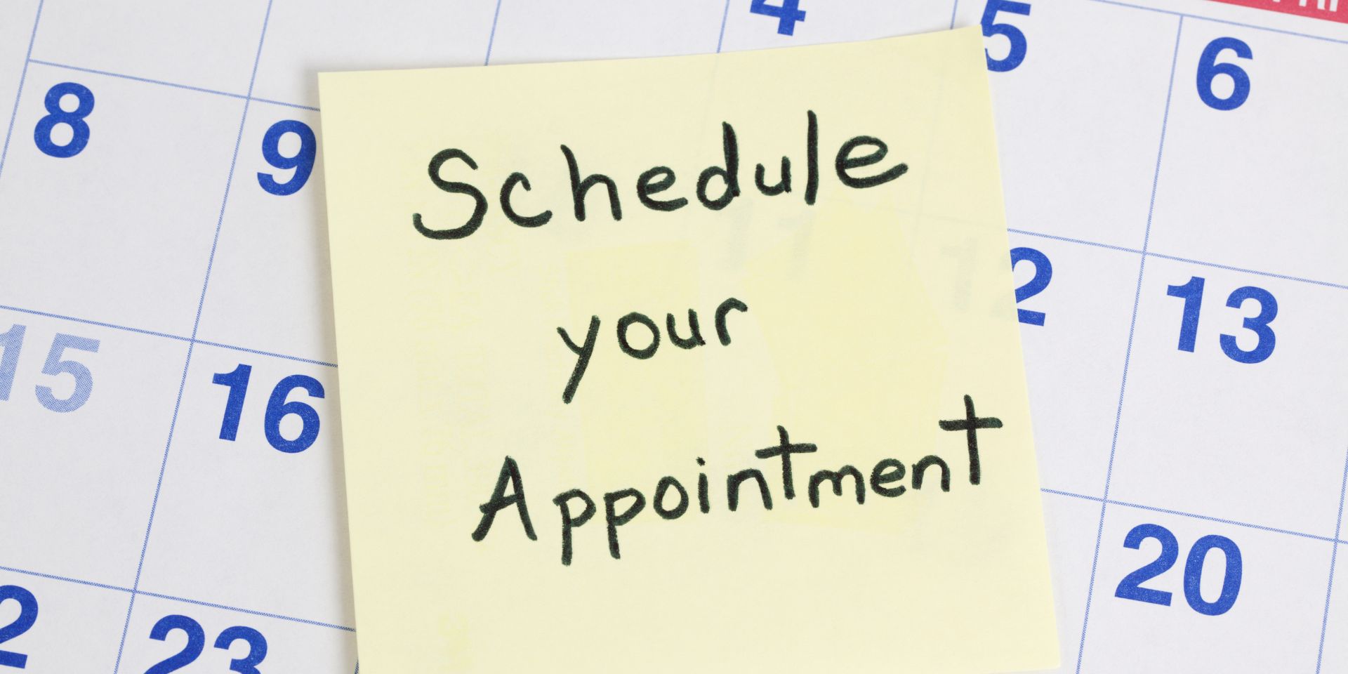 A calendar with a 'schedule your appointment' sticky note.